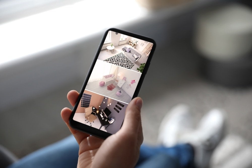 Monitoring camera footage on a phone.