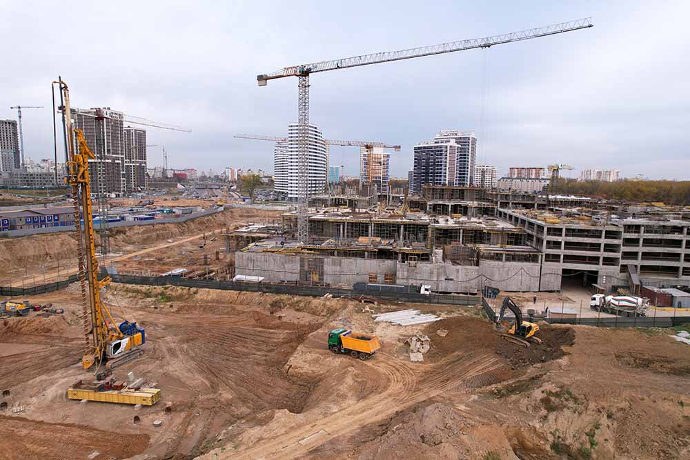 A large job site with a crane and equipment