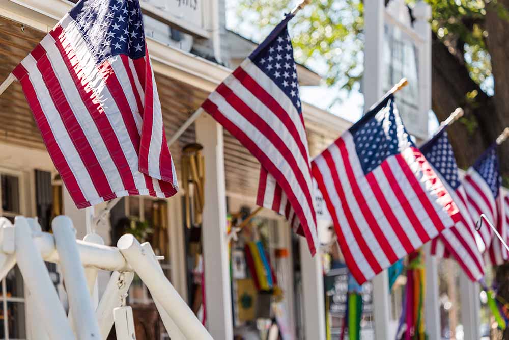 American flags in a row in a small town.