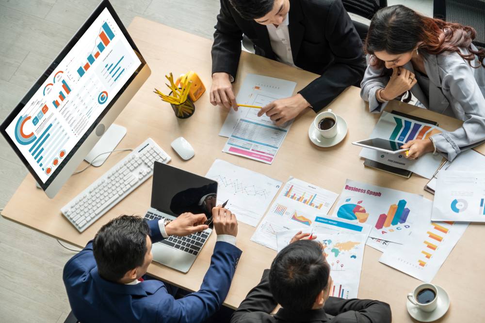 A business team gathered around a conference table.